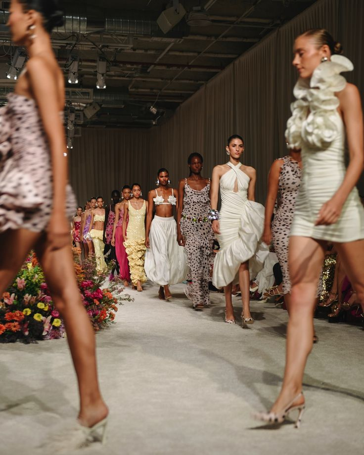 Models walking in a sustainability-led runway show